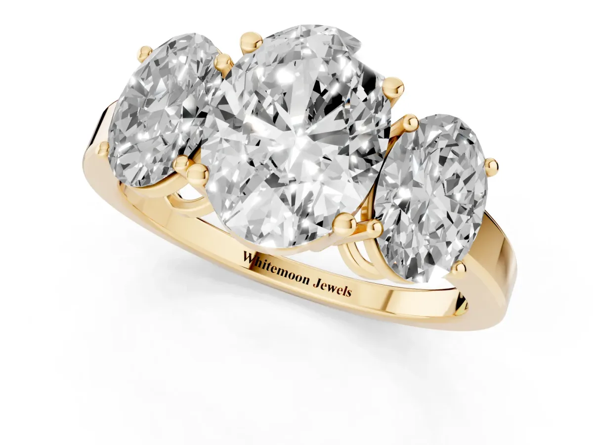 Three-Stone Oval Cut Cut Diamond Engagement Ring with Flat Band and Four-Prong Setting Yellow gold