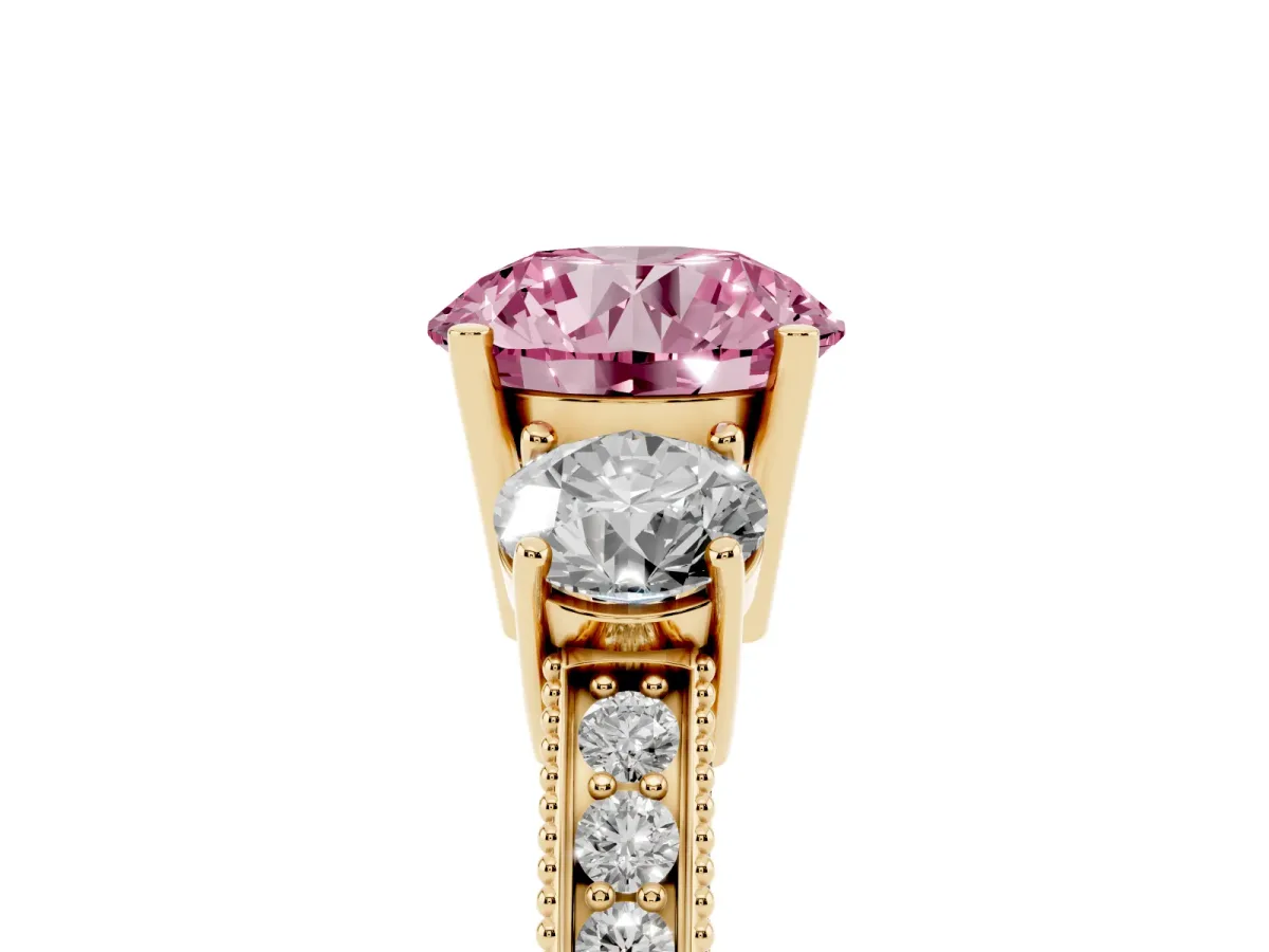 Fancy Pink Round Cut Three-Stone Diamond Ring with Pavé Band and Four-Prong Setting Yellow gold