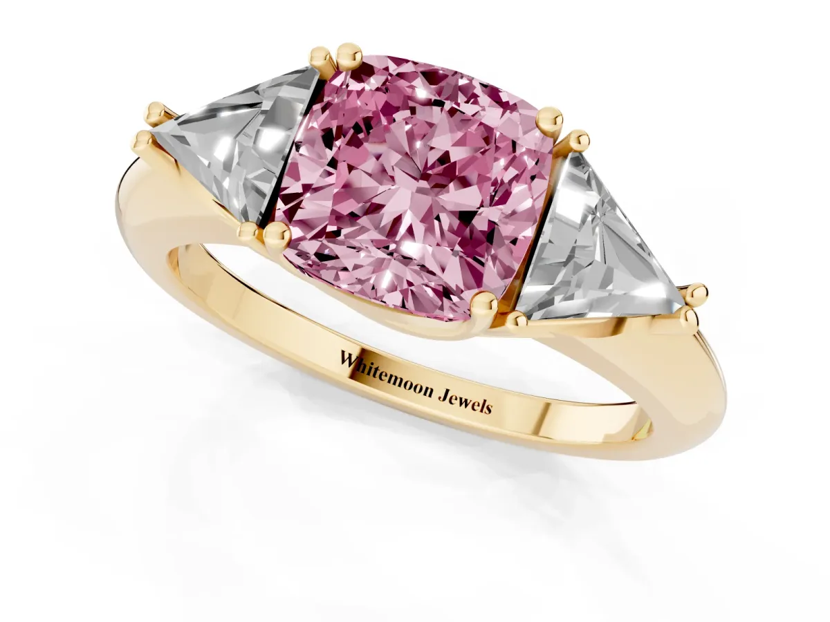 Fancy Pink Three-Stone Cushion Cut Diamond Engagement Ring with Trillion Side Stones and Prong Setting Yellow gold