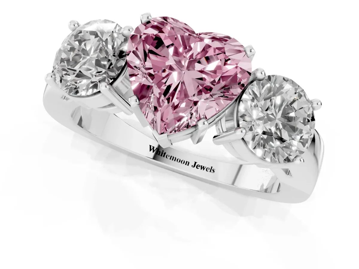Fancy Pink Three-Stone Heart Cut Diamond Ring with Round Side Stones, Classic Band, and Four-Prong Setting Silver