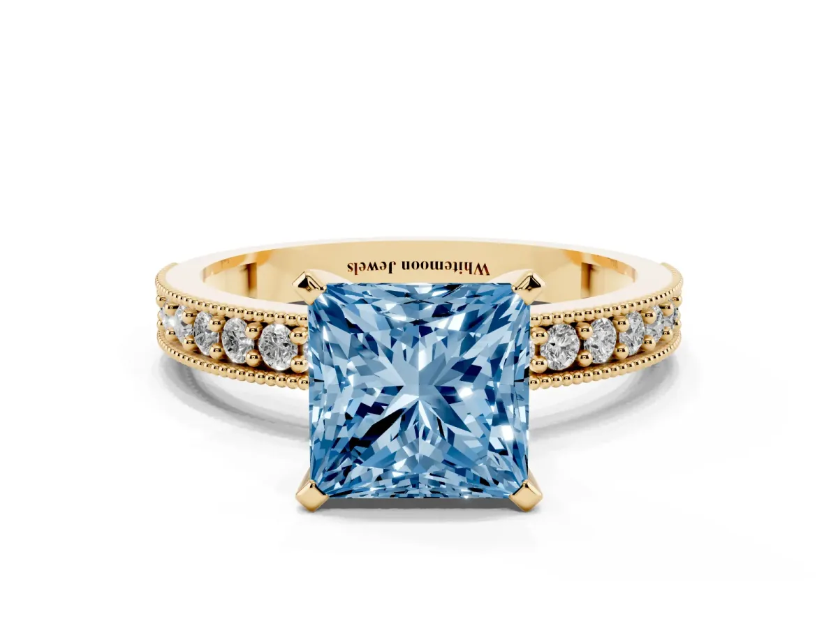 Fancy Blue Princess Cut Diamond Milgrain Pavé Engagement Ring with Four-Prong Setting Yellow gold