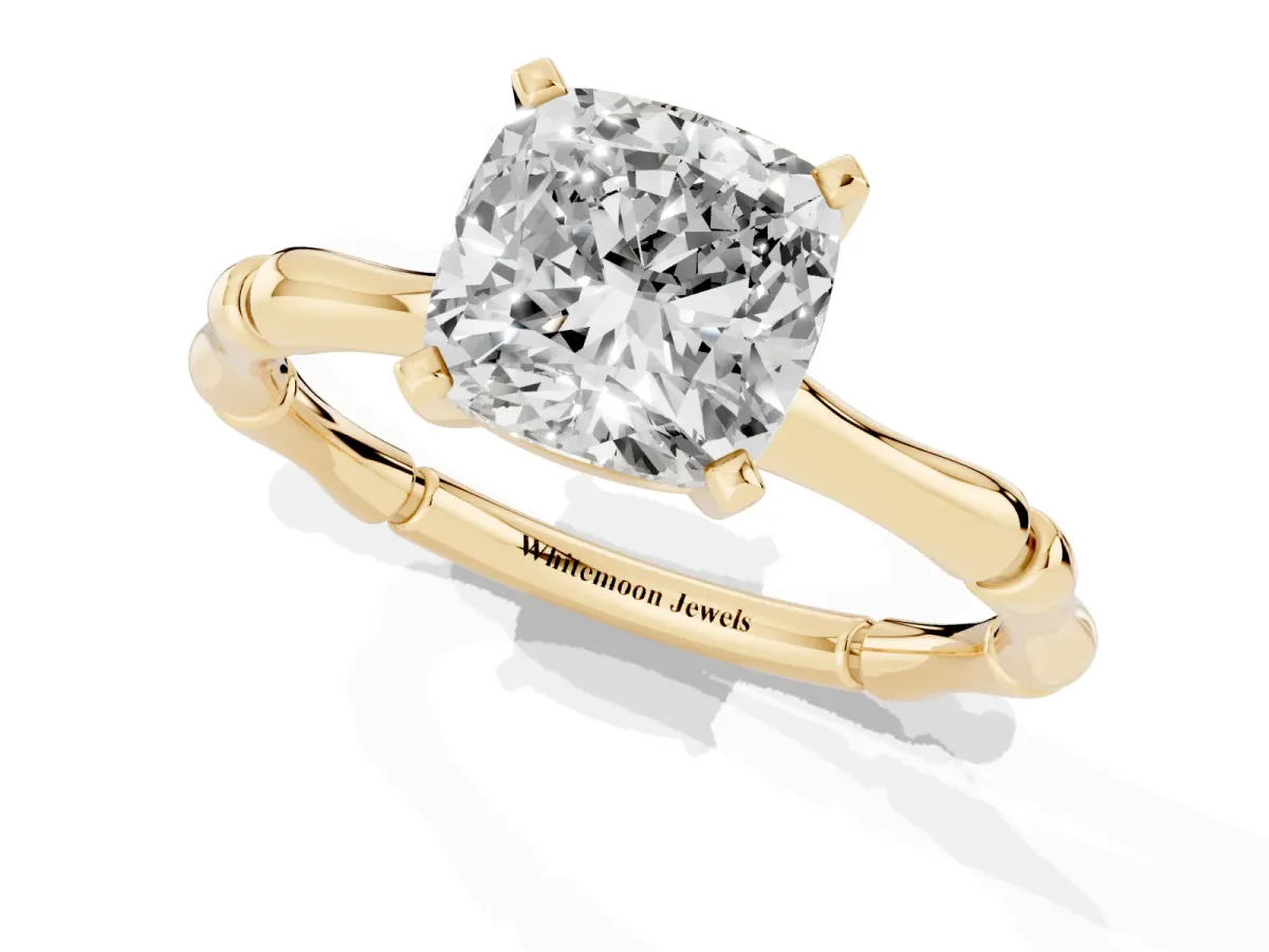 Cushion Cut Solitaire Diamond Ring with Bamboo Band and Four-Prong Setting Yellow gold