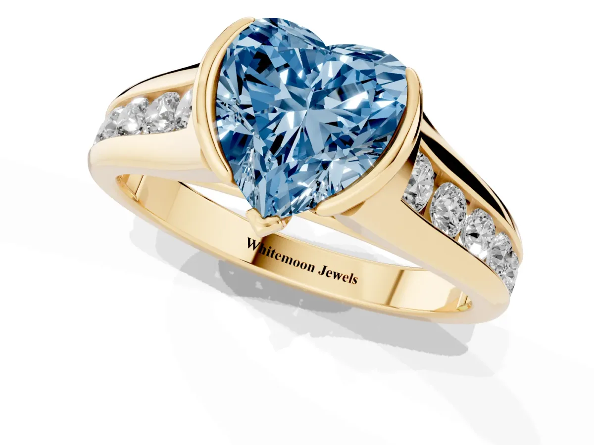 Fancy Blue Heart Cut Solitaire Bezel-Set Diamond Ring with Channel-Set Band Yellow gold