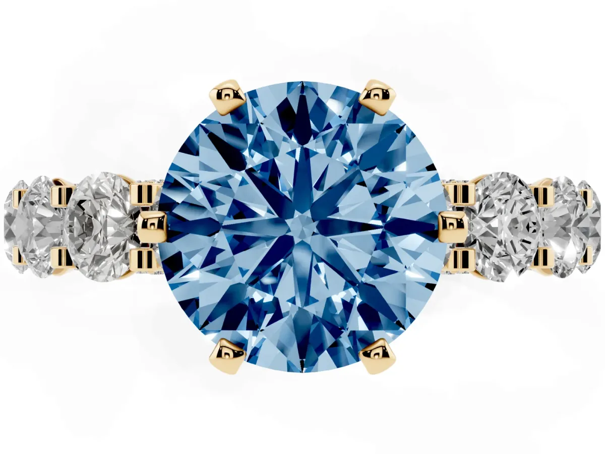 Fancy Blue Round Cut Diamond Side Stone Engagement Ring with Four-Prong Setting Yellow gold