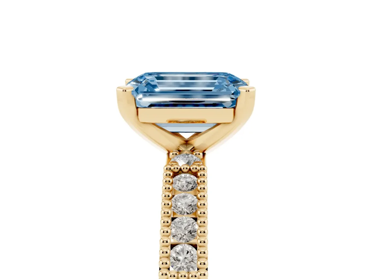Fancy Blue Emerald Cut Solitaire with Pavé Band and Four-Prong Setting Yellow gold