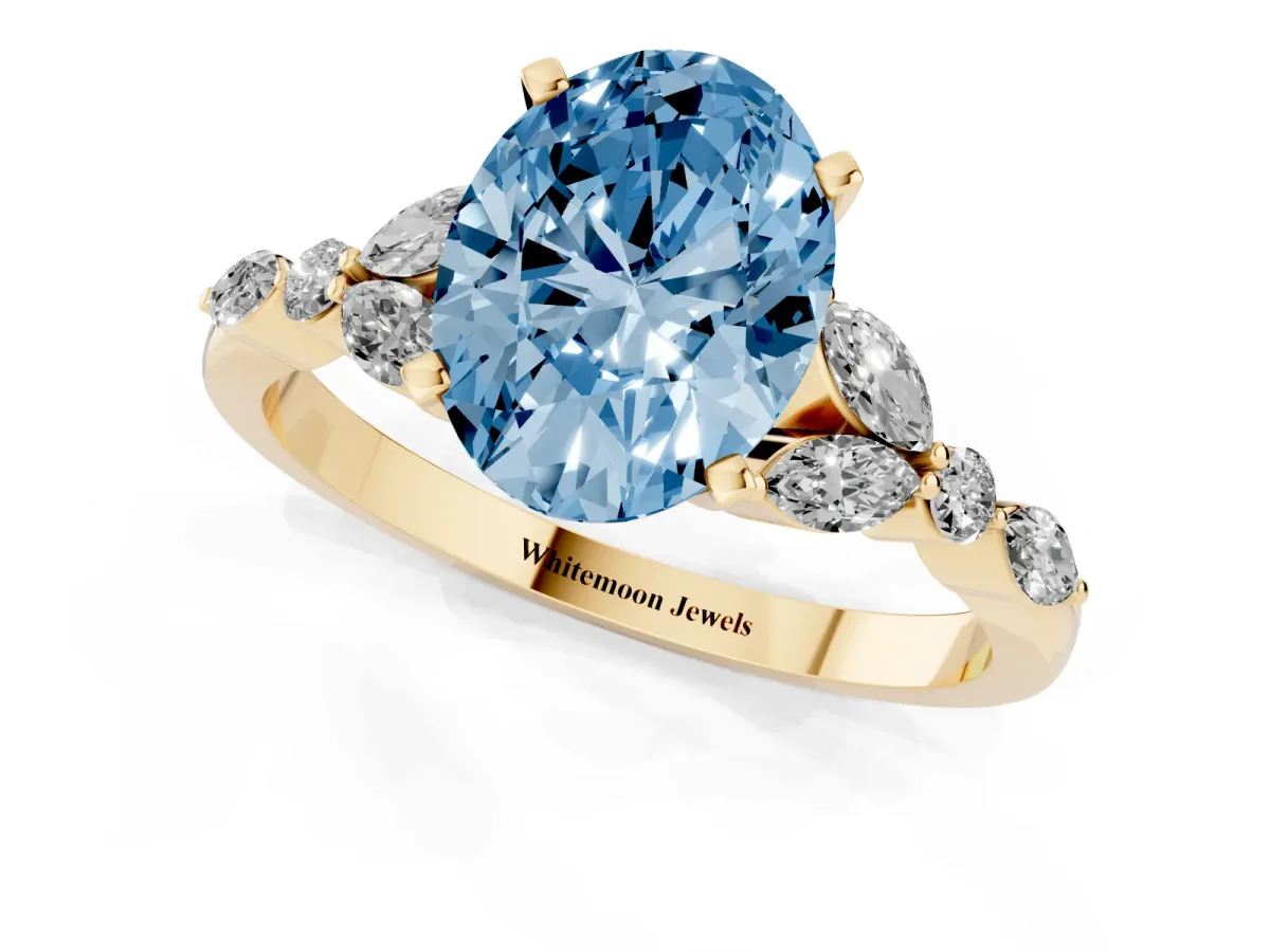 Fancy Blue Oval Cut Diamond Solitaire Ring with Side Stones and Four-Prong Setting Yellow gold