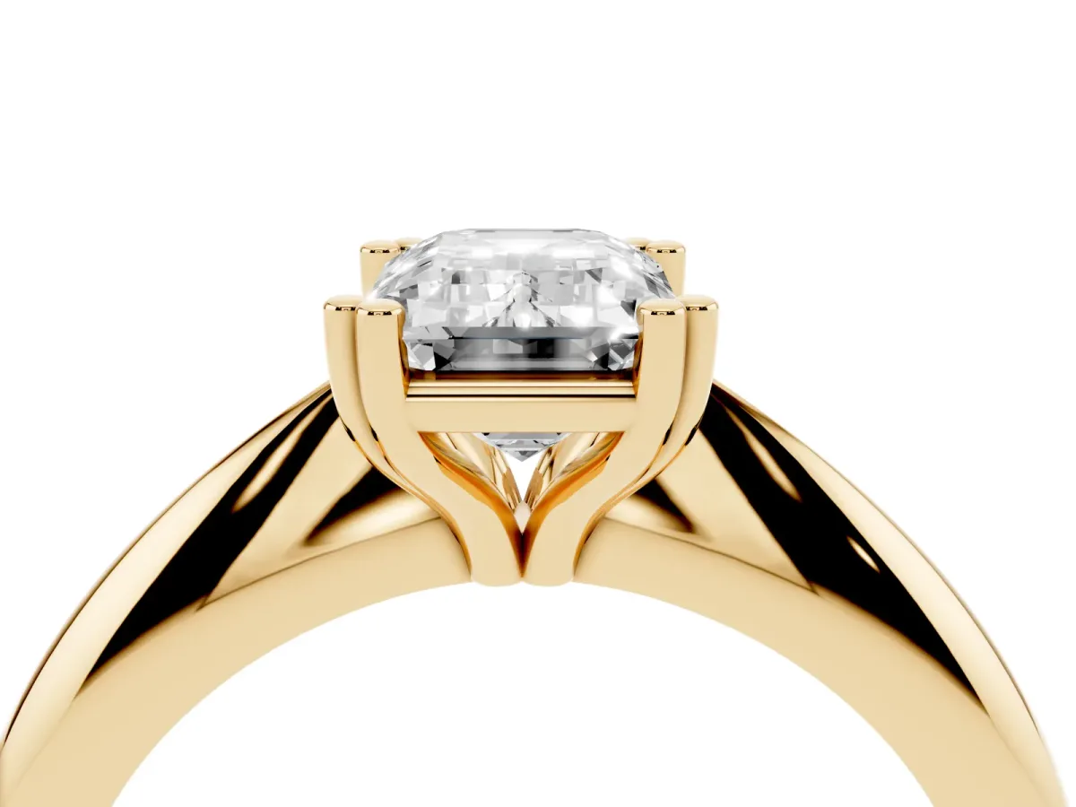 Emerald Cut Cut Solitaire Engagement Ring with Tapered Band and Four-Prong Setting Yellow gold