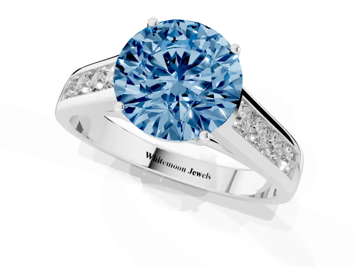 Fancy Blue Round Cut Brilliant Channel-Set Solitaire Ring with Four-Prong Setting Platinum
