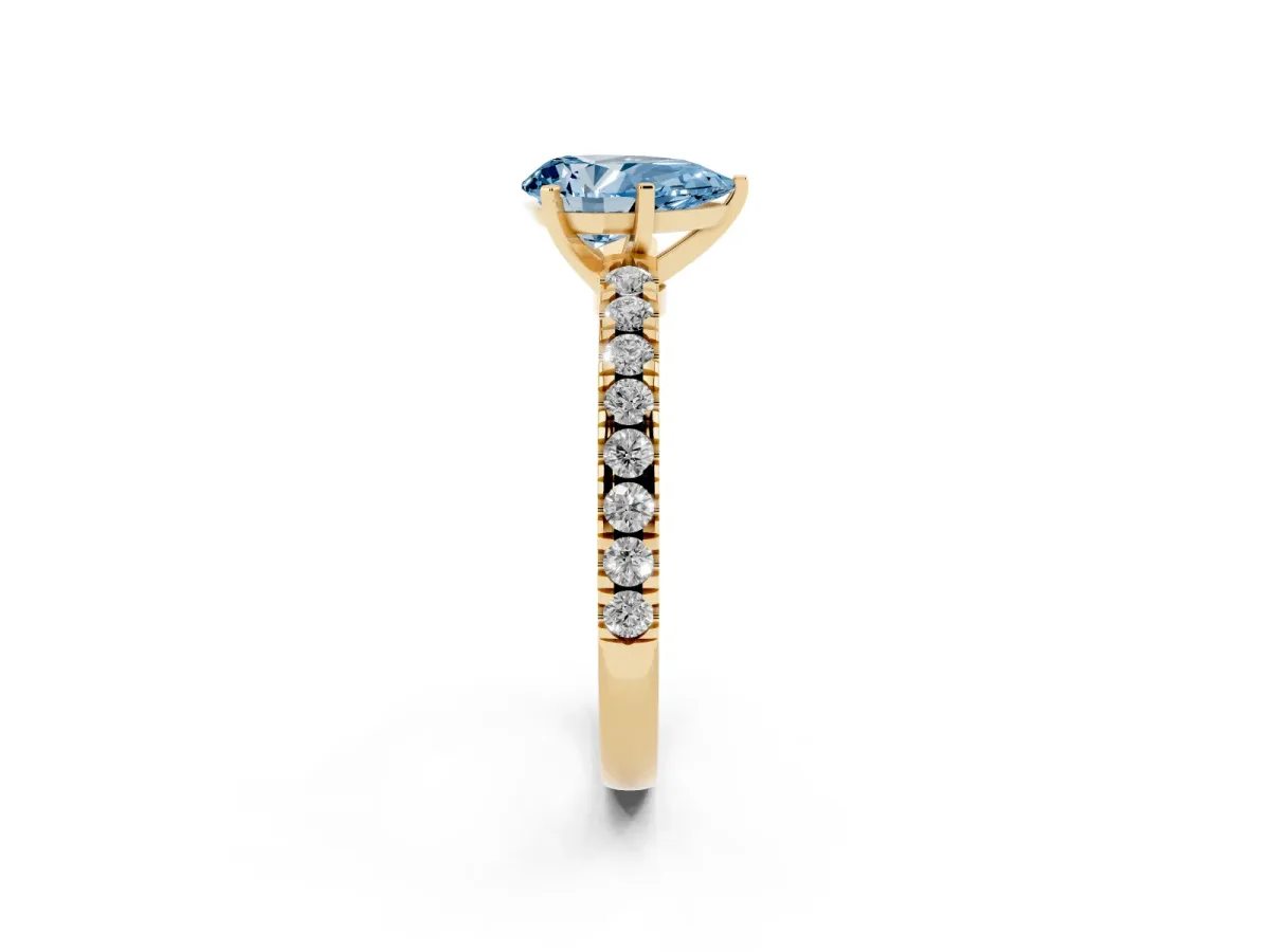 Fancy Blue Pear Cut Solitaire Diamond with Pavé Band and Four-Prong Setting Yellow gold