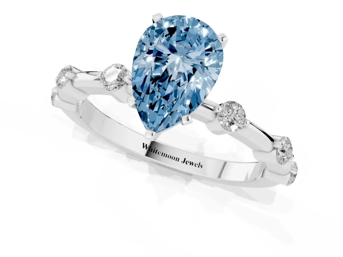 Fancy Blue Pear Cut Solitaire Diamond Ring with Bezel Set Side Stones and Prong Setting Platinum