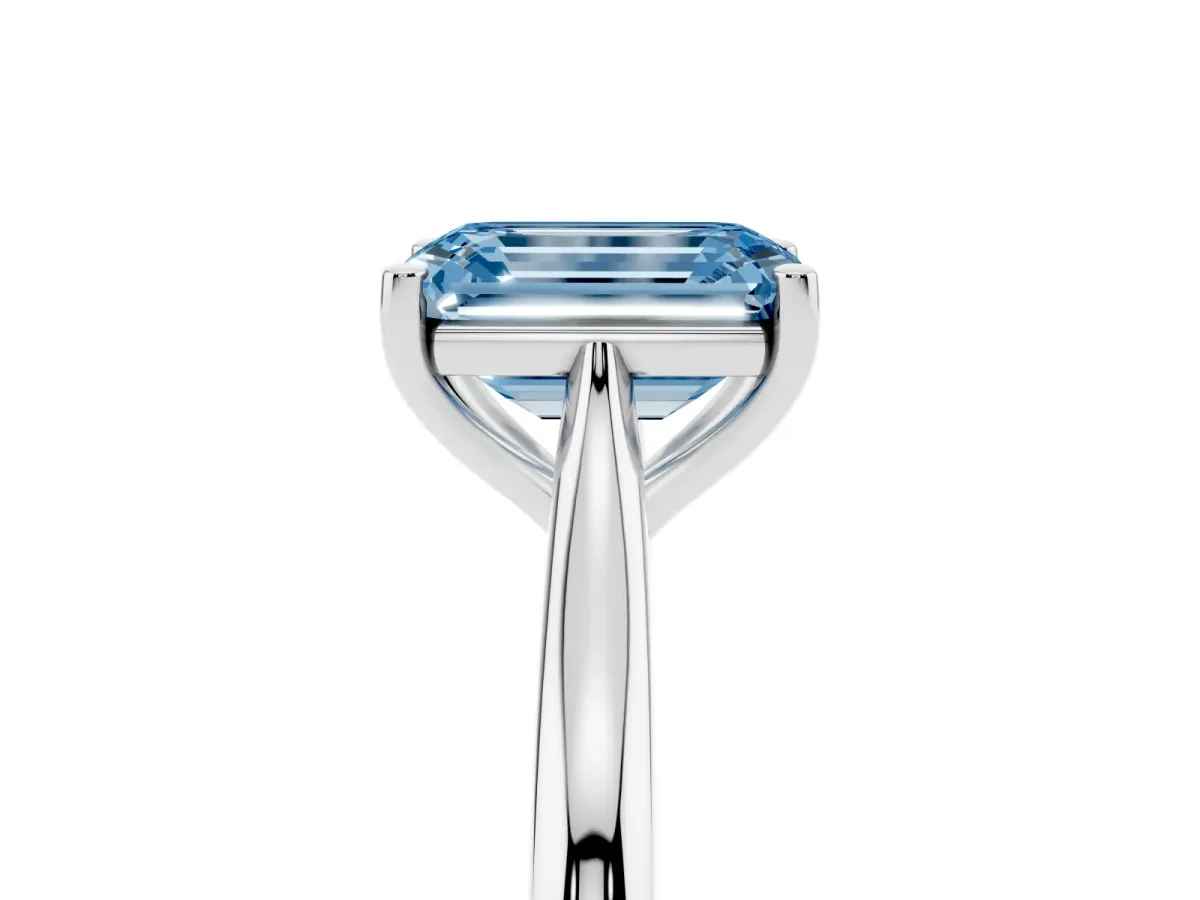 Fancy Blue Emerald Cut Cut Solitaire Ring with Cathedral Band and Four-Prong Setting Silver