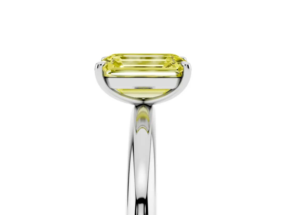 Fancy Yellow Emerald Cut Solitaire Diamond Ring with Four-Prong Setting on a Plain Band Platinum
