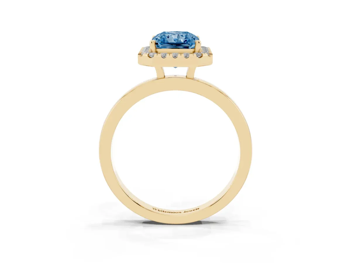 Fancy Blue Radiant Cut Halo Diamond Solitaire with Pavé Band and Four-Prong Setting Yellow gold