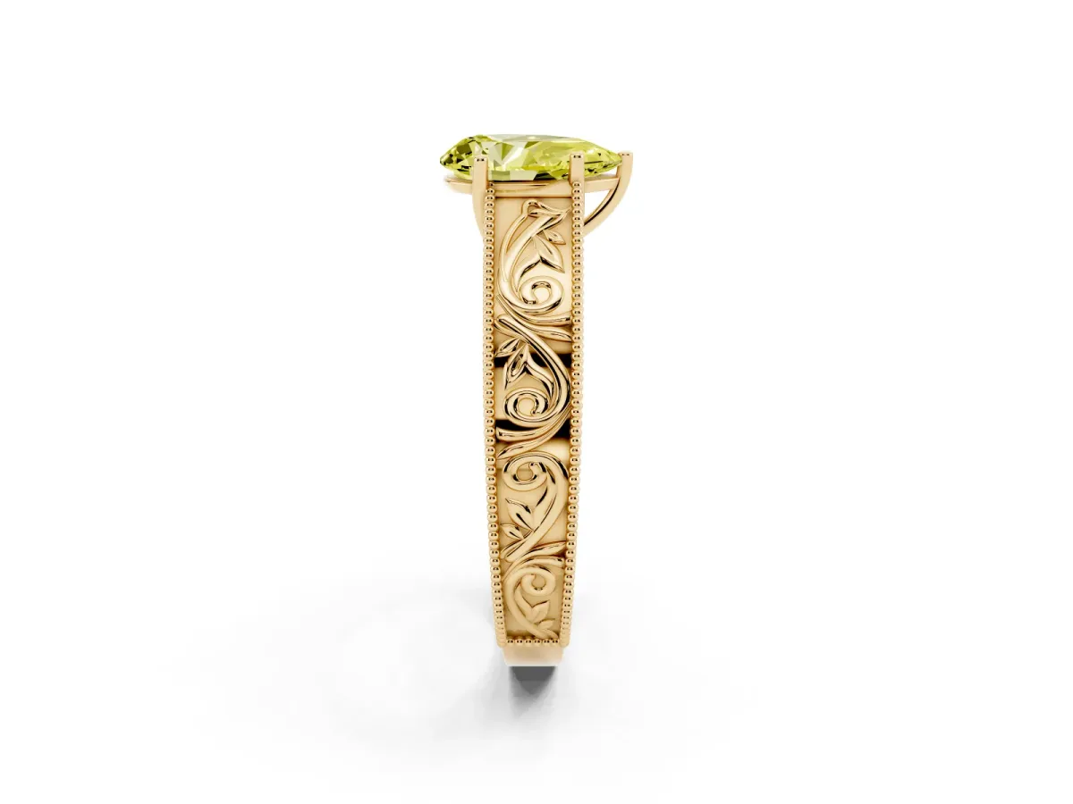 Fancy Yellow Pear Cut Diamond Solitaire Ring with Engraved Band and Four-Prong Setting Yellow gold