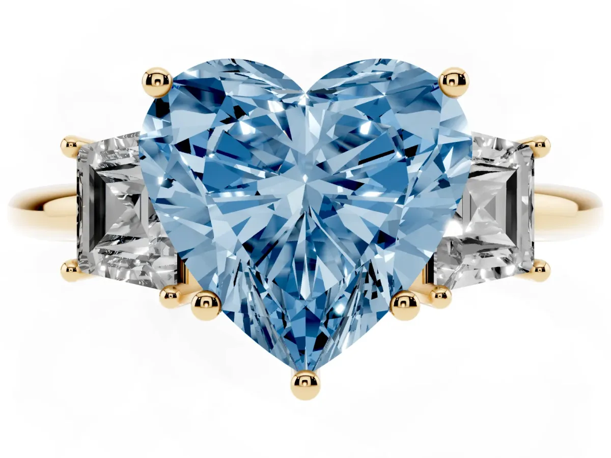 Fancy Blue Heart Cut Diamond Three-Stone Ring with Trapezoid Side Stones and Prong Setting Yellow gold