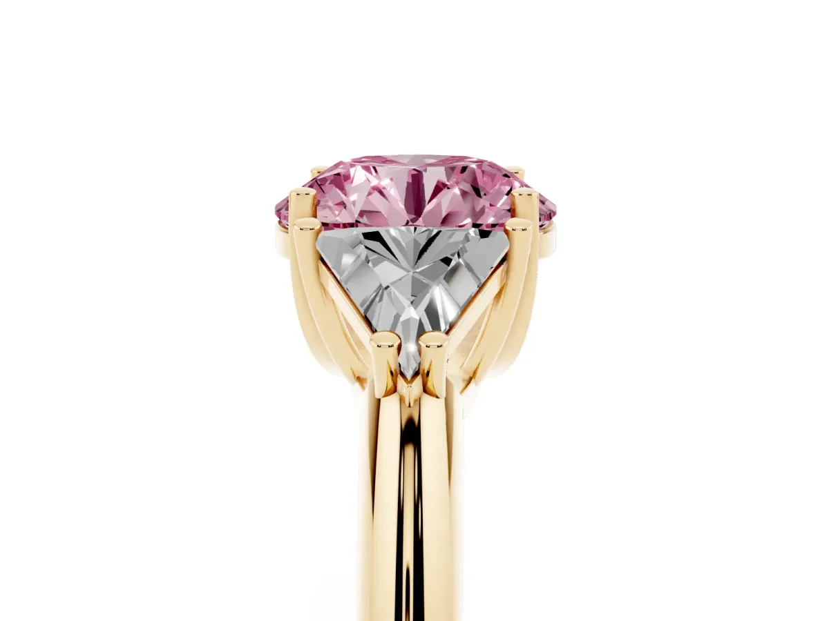 Fancy Pink Three-Stone Round Cut Diamond Engagement Ring with Trillion Side Stones and Prong Setting Yellow gold