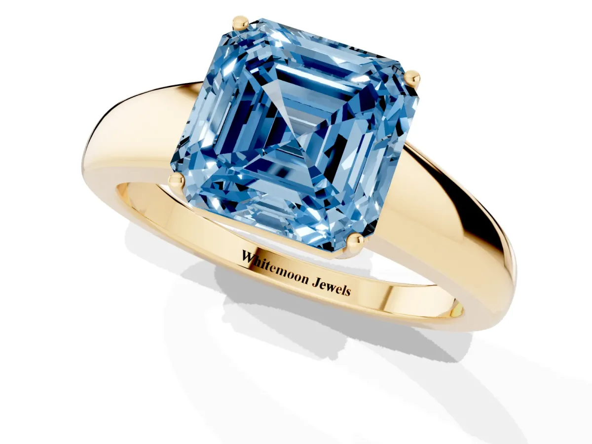 Fancy Blue Asscher Cut Solitaire Diamond Ring with Tapered Band and Four-Prong Setting Yellow gold