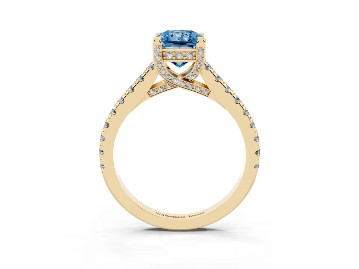 Fancy Blue Radiant Cut Brilliant Diamond Solitaire with Pavé Band and Four-Prong Setting Yellow gold