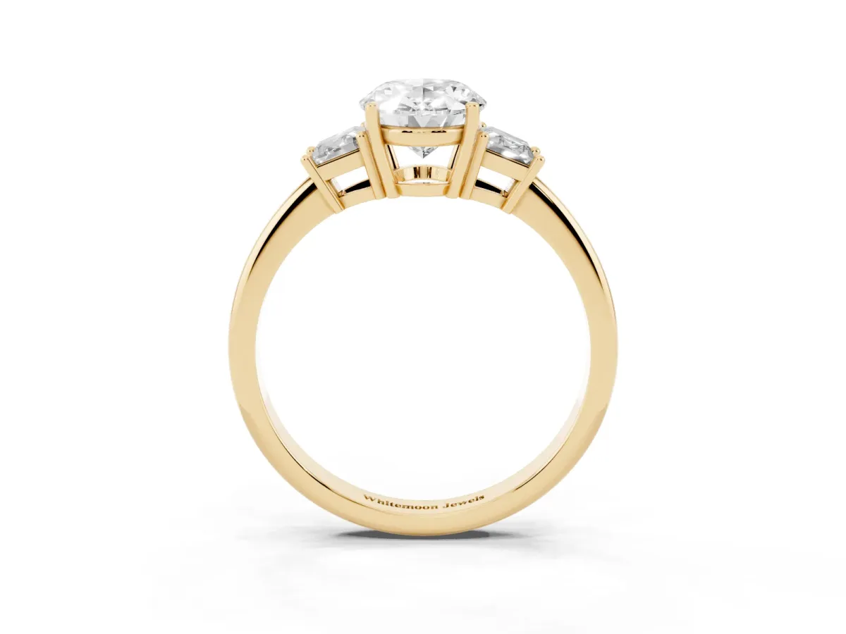 Oval Cut Diamond Three-Stone Ring with Trapezoid Side Stones and Prong Setting Yellow gold
