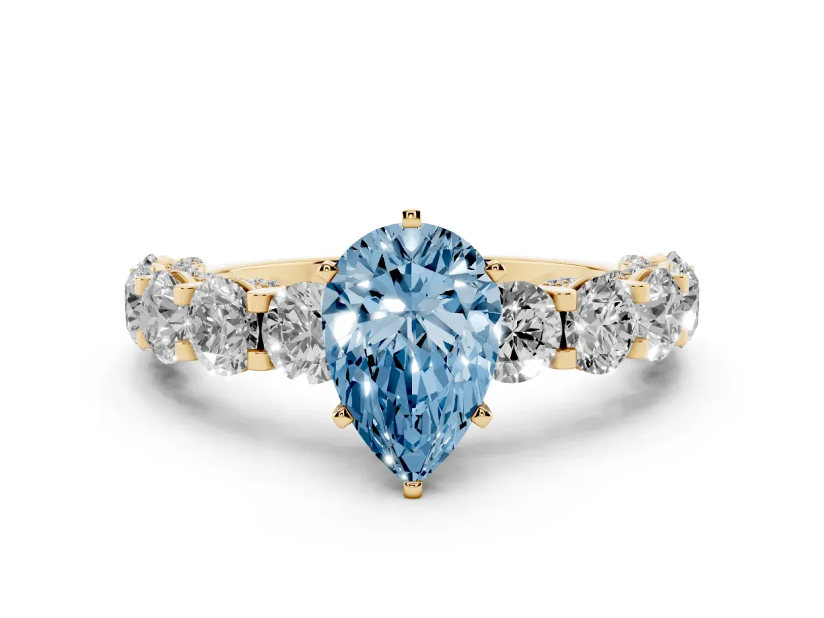 Fancy Blue Pear Cut Diamond Side Stone Engagement Ring with Four-Prong Setting Yellow gold