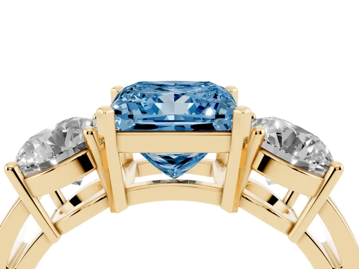 Fancy Blue Three-Stone Princess Cut Diamond Ring with Round Side Stones, Classic Band, and Four-Prong Setting Yellow gold