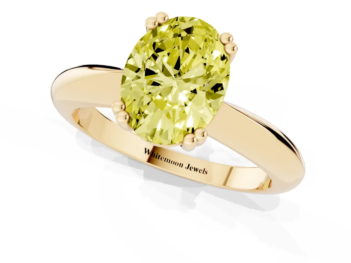 Fancy Yellow Oval Cut Cut Solitaire Engagement Ring with Tapered Band and Four-Prong Setting Yellow gold