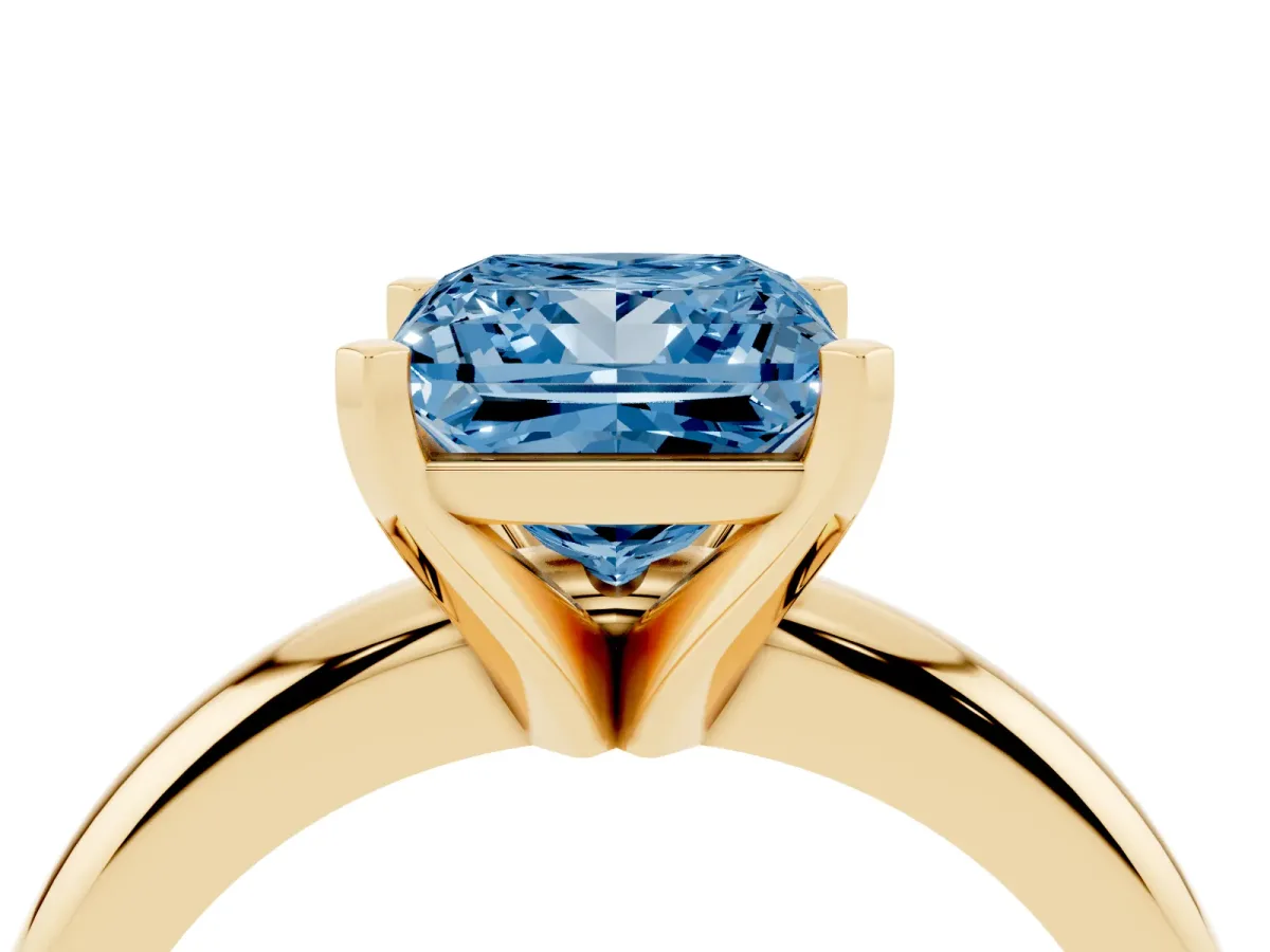 Fancy Blue Princess Cut Diamond Solitaire Engagement Ring with Round Band and Four-Prong Setting Yellow gold
