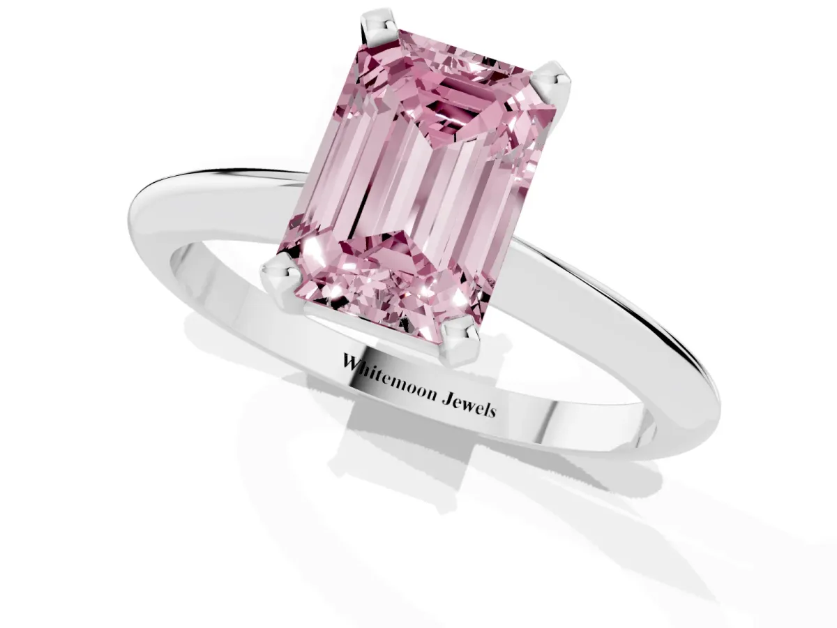 Fancy Pink Emerald Cut Cut Solitaire Ring with Four-Prong Setting on a Classic Band Platinum