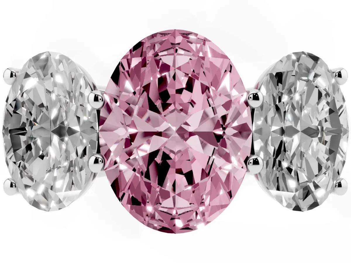 Fancy Pink Oval Cut Three-Stone Diamond Ring with Prong Setting on a Classic Band Platinum