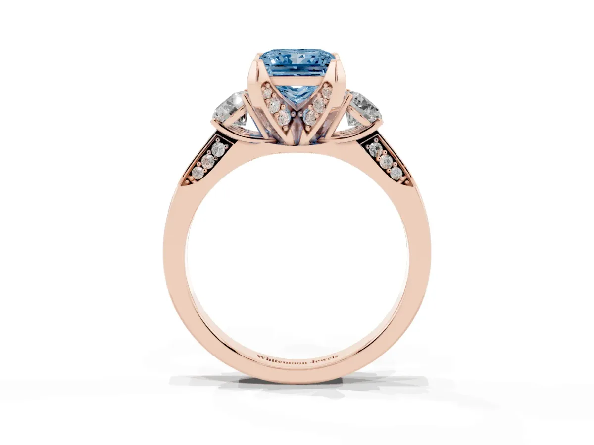 Fancy Blue Princess Cut Brilliant Three-Stone Diamond Ring with Pavé Band and Four-Prong Setting Rose gold