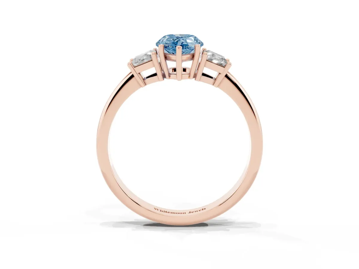 Fancy Blue Pear Cut Diamond Three-Stone Ring with Trapezoid Side Stones and Prong Setting Rose gold