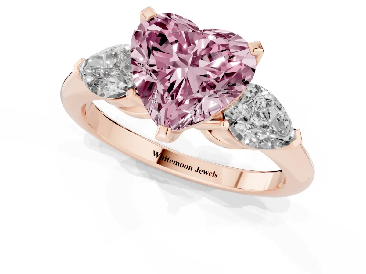 Fancy Pink Three-Stone Heart Cut Diamond Ring with Pear Side Stones and Four-Prong Setting Rose gold