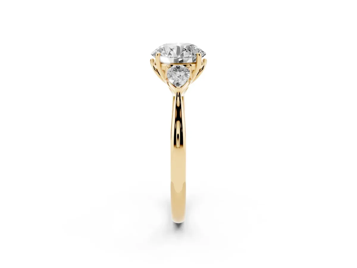 Round Cut Diamond Three-Stone Ring with Pear Side Stones and Prong Setting Yellow gold
