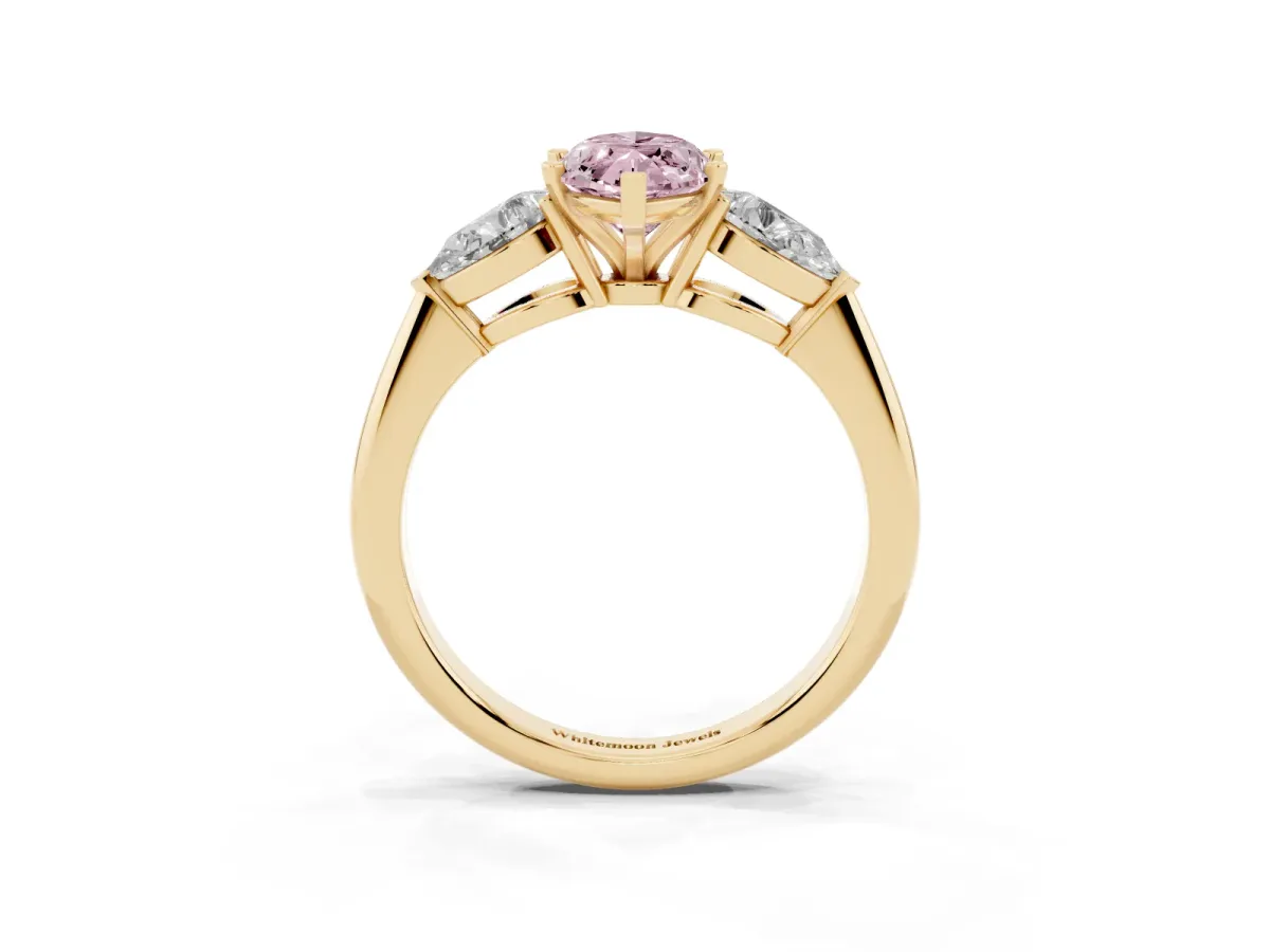 Fancy Pink Three-Stone Marquise Cut Diamond Ring with Pear Side Stones and Four-Prong Setting Yellow gold