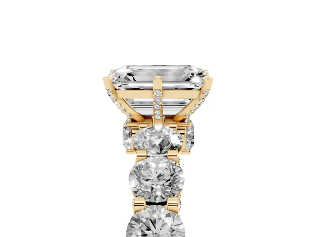 Emerald Cut Diamond Side Stone Engagement Ring with Four-Prong Setting Yellow gold