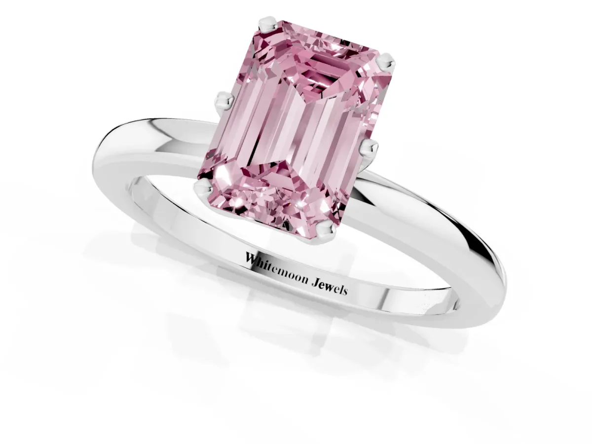 Fancy Pink Emerald Cut Solitaire Diamond Ring with Six-Prong Setting on a Classic Band Platinum