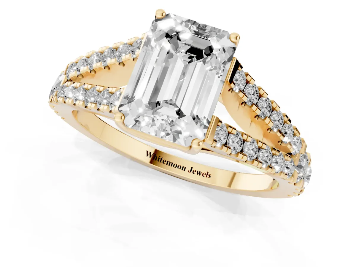 Emerald Cut Diamond Split Shank Engagement Ring with Round Pavé and Prong Setting Yellow gold