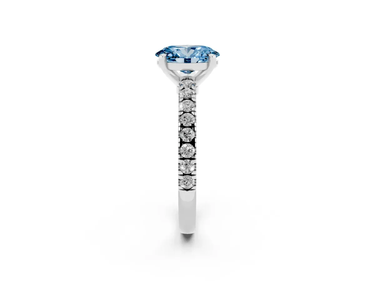 Fancy Blue Oval Cut Solitaire Diamond with Pavé Band and Four-Prong Setting Silver