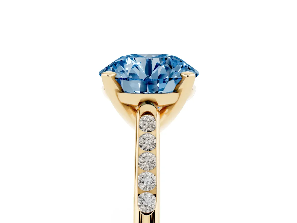 Fancy Blue Round Cut Diamond Solitaire Ring with Channel Set Round Band and Prong Setting Yellow gold