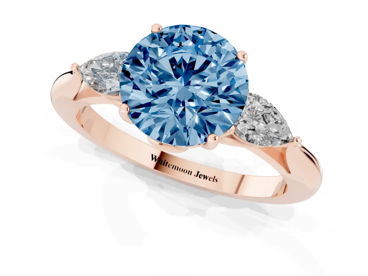 Fancy Blue Round Cut Diamond Three-Stone Ring with Pear Side Stones and Prong Setting Rose gold