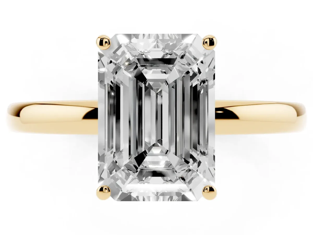 Emerald Cut Solitaire Diamond Ring with Prong Setting and Plain Band Yellow gold