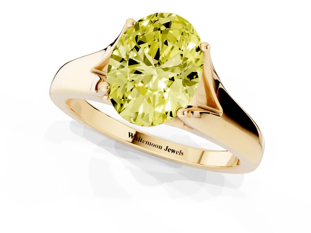 Fancy Yellow Oval Cut Solitaire Diamond Ring with Cathedral Band and Four-Prong Setting Yellow gold