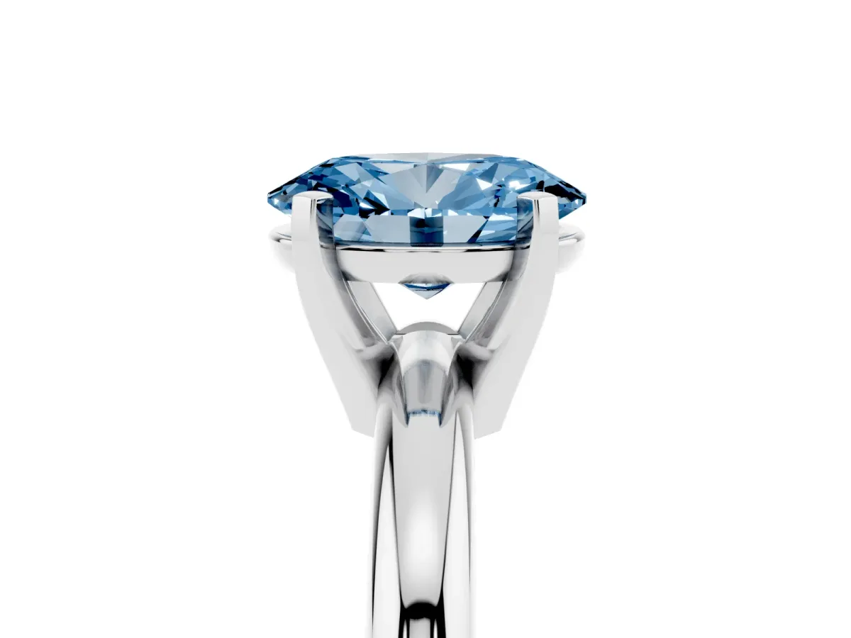 Fancy Blue Oval Cut Diamond Solitaire Engagement Ring with Round Band and Four-Prong Setting Platinum