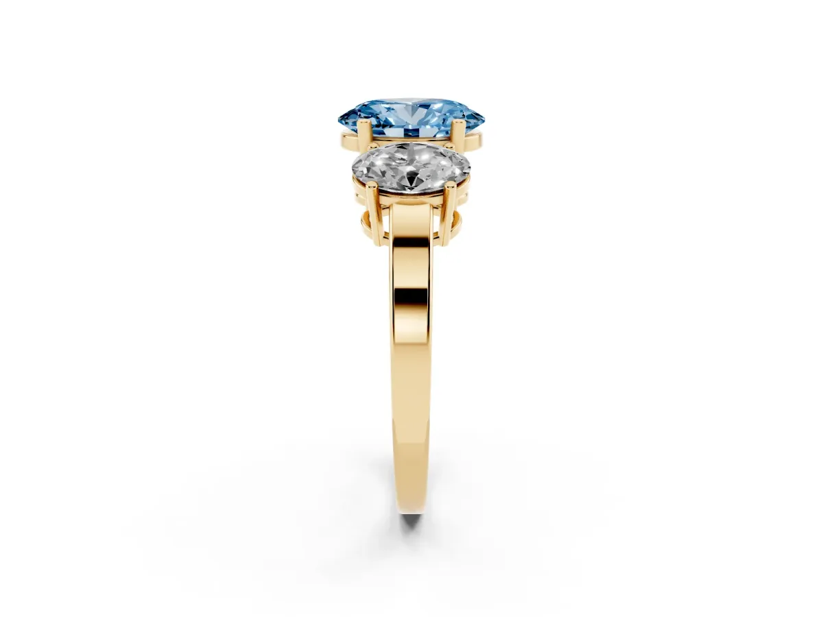 Fancy Blue Three-Stone Oval Cut Cut Diamond Engagement Ring with Flat Band and Four-Prong Setting Yellow gold