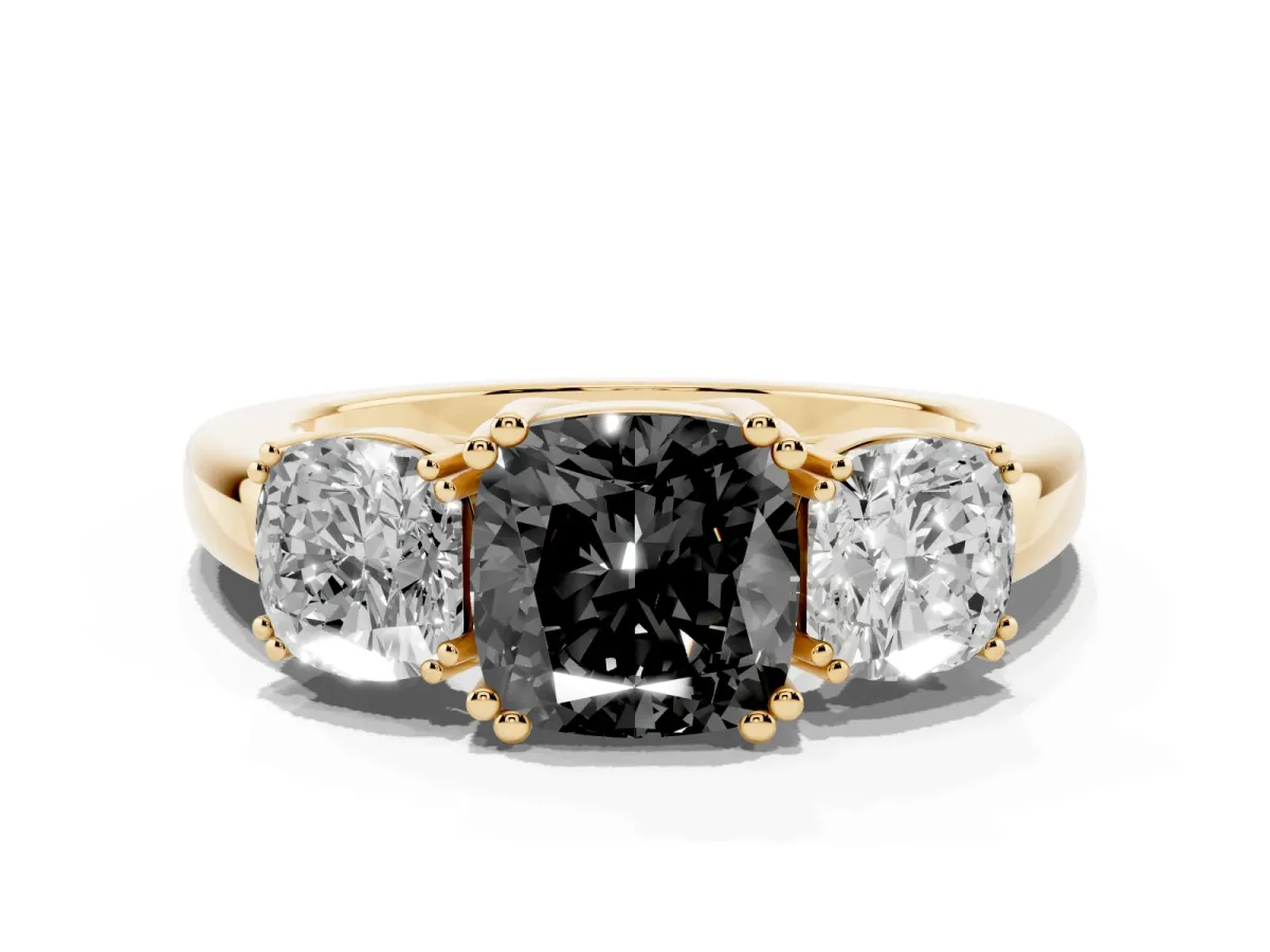 Fancy Black Three-Stone Cushion Cut Cut Diamond Ring with Channel Set Band and Four-Prong Setting Yellow gold