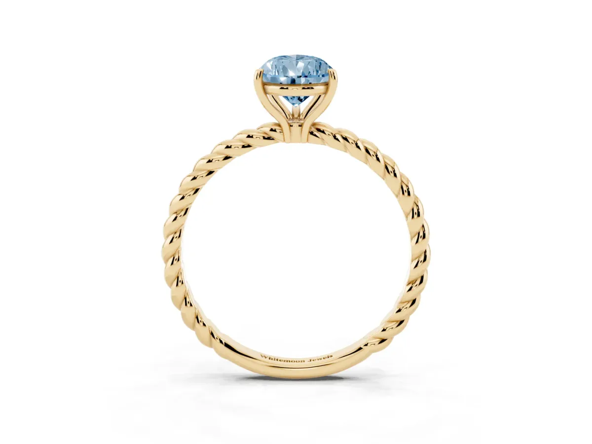 Fancy Blue Pear Cut Solitaire Twist Band Ring with Four-Prong Setting Yellow gold