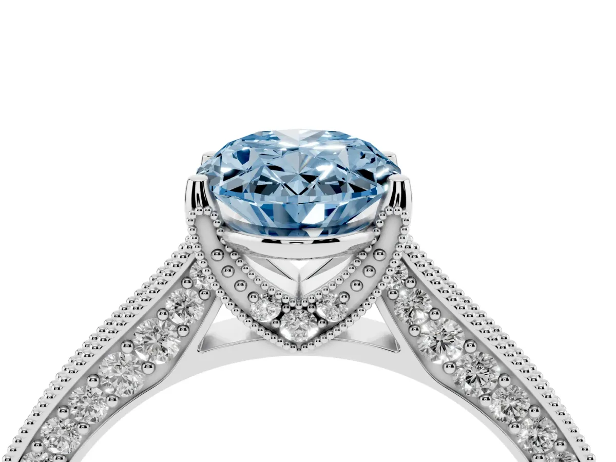 Fancy Blue Oval Cut Cut Diamond Solitaire Ring with Milgrain Pave Band and Four Prong Setting Silver
