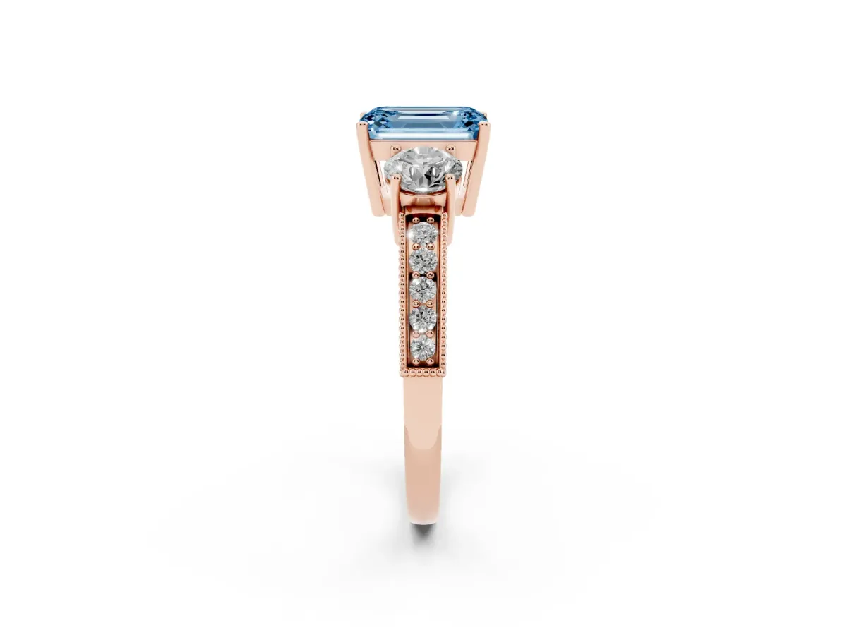 Fancy Blue Emerald Cut Three-Stone Diamond Ring with Pavé Band and Four-Prong Setting Rose gold