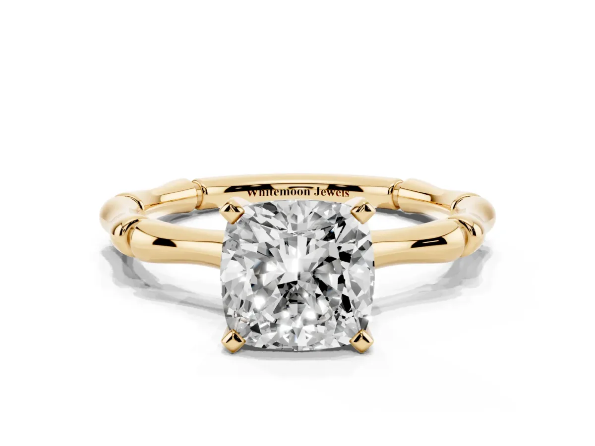 Cushion Cut Solitaire Diamond Ring with Bamboo Band and Four-Prong Setting Yellow gold