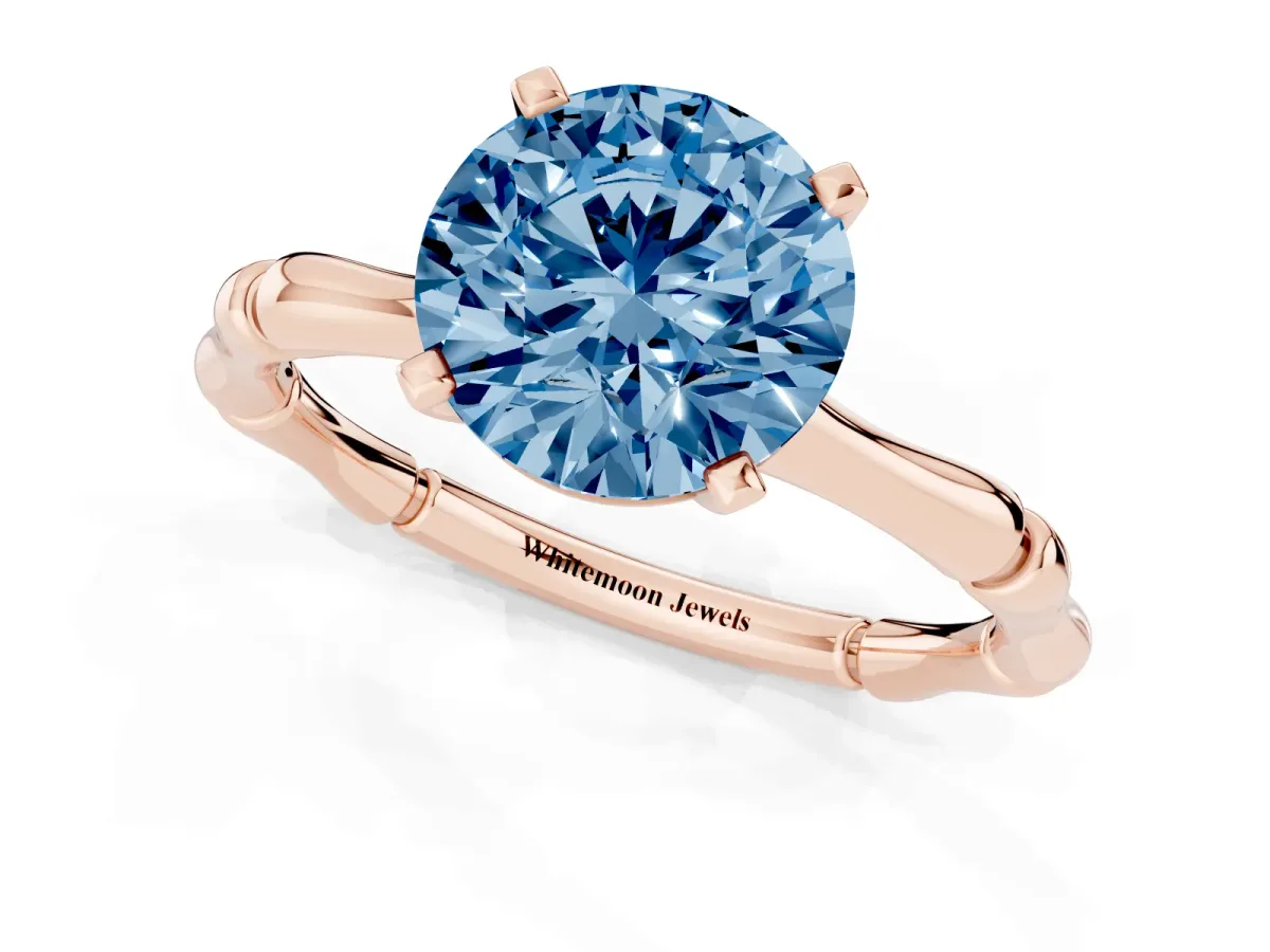 Fancy Blue Round Cut Solitaire Diamond Ring with Bamboo Band and Four-Prong Setting Rose gold